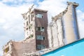 Old abandoned dirty comunism silo for sand and silicon and factory building during demolition Royalty Free Stock Photo