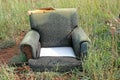 OLD ABANDONED EASY CHAIR IN THE OPEN Royalty Free Stock Photo