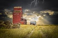 Old abandoned elevator under a dark stormy sky with lightening.