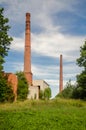 Old abandoned factory with big chimneys in Pavilosta, Latvia