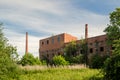 Old abandoned factory with big chimneys in Pavilosta, Latvia