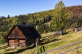 An old, abandoned farmhouse in a mountain meadow above the Carpathians. Beautiful walking landscape in Ukraine. autumn time Royalty Free Stock Photo