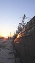 Old abandoned fishing boat at sunset Royalty Free Stock Photo