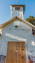 Old abandoned Florida church with locked wooden doors