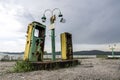 Old and abandoned gas station on a forgotten highway, a mystical and gloomy atmospheric place dramatic sky