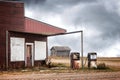 Old abandoned gas station with two broken gas pumps Royalty Free Stock Photo