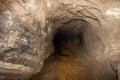 Old abandoned gold mine underground tunnel. Royalty Free Stock Photo