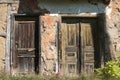 Old abandoned grunge rural house doors