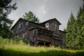 Old, abandoned hostel on a mountain trail.