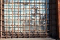 Old abandoned house with broken windows, rusted gratings Royalty Free Stock Photo