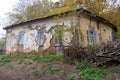 Old abandoned house with cracked clay walls and wooden windows in Poltava region, Ukraine Royalty Free Stock Photo