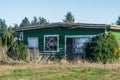 Old abandoned house in disrepair on cold fall day. Royalty Free Stock Photo