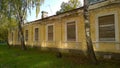 Old abandoned house in disrepair. Windows are filled with wooden planks instead of glass. Poverty, devastation, economic, financia Royalty Free Stock Photo