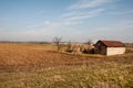 Old abandoned house in a field and blue sky Royalty Free Stock Photo