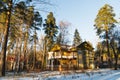 An old abandoned house in a pine winter forest Royalty Free Stock Photo