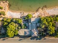 old abandoned house with pool on the beach overgrown with palm trees and plants, lost places, tarragona spain Royalty Free Stock Photo