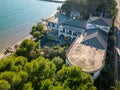 old abandoned house with pool on the beach overgrown with palm trees and plants, lost places, tarragona spain Royalty Free Stock Photo