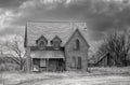An old abandoned spooky house in spring on a farm yard in rural Canada Royalty Free Stock Photo