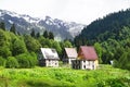 Old abandoned houses in Auadhara. Spring mountain landscape. Caucasus Mountains, Republic of Abkhazia Royalty Free Stock Photo