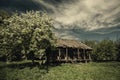 Old abandoned hut under dramatic skies