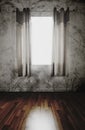Old abandoned interior , wooden floor and grunge concrete wall with curtain opening receiving sunlight, dark environment Royalty Free Stock Photo