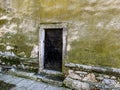 Old abandoned iron doors to church, building in the historic center of the city, Pezinok