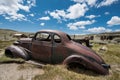 Old abandoned jalopy car sitting in Bodie State Historical Park, a gold rush ghost town Royalty Free Stock Photo