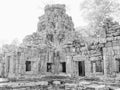 An old abandoned Khmer building, medieval architecture of Cambodia. Black and white, film grain Royalty Free Stock Photo