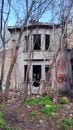 An old abandoned mansion with broken windows and graffiti on the walls Royalty Free Stock Photo
