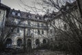 Old abandoned mansion in mystic spooky forest. Haunted house with dark atmosphere, full moon, bats and creepy details like in horr Royalty Free Stock Photo