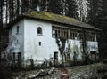 Old abandoned mansion in mystic spooky forest. Haunted house with dark atmosphere, full moon, bats and creepy details like in horr Royalty Free Stock Photo