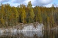 An old abandoned marble quarry in golden autumn. Karelia, Russia