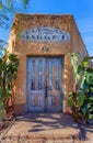 Old abandoned market with blue doors weathered stucco Royalty Free Stock Photo