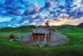 An old abandoned mine against the backdrop of a sunset sky Royalty Free Stock Photo