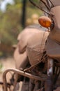 Old abandoned motorcycle with rusty components in the dust Royalty Free Stock Photo