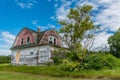 Old, abandoned pink house on the prairies in Verwood, Saskatchewan, Canada