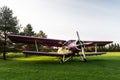 An old, abandoned plane in violet and yellow Royalty Free Stock Photo