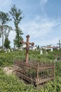 Old abandoned Polish city cemetery in Zhydachiv, Lviv region, Ukraine. Weathered old metal crosses and fence, abandoned Royalty Free Stock Photo