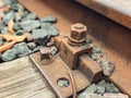 Old, abandoned railroad. the rails are fixed with strong metal bolts to the ground. rusty structure for the passage of trains on