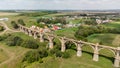 An old abandoned railway bridge with arches Royalty Free Stock Photo