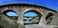 Old abandoned railway viaduct over the road Royalty Free Stock Photo