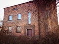 Old abandoned red brick house facade decay abstract