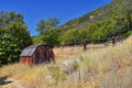 Old abandoned red wood cabin on Hamongog hiking trail below Lone Peak, Wasatch Mountains, Utah. Royalty Free Stock Photo