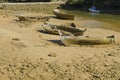 Old and abandoned rowing boat stranded on the shore of the in Cadiz