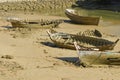 Old and abandoned rowing boat stranded on the shore of the in Cadiz