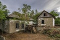 Old abandoned ruined house in dead village. Deserted and destroyed dwelling on farm yard. Neglected building countryside Royalty Free Stock Photo