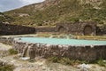 Wellness pool fed by a sulfur spring at old abandoned ruins of a Hotel at the Termas del Sosneado Royalty Free Stock Photo