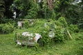 Old abandoned rusty car in green tropical jungle forest. Royalty Free Stock Photo