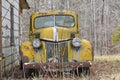 An Old Abandoned Rusty Car Sits Alone In A Field Royalty Free Stock Photo