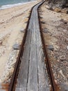Old abandoned rusty rail track on island on Australian north coast Queensland